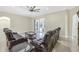 Comfortable living room with stylish seating, ceiling fan, and glass sliding doors, perfect for entertaining and relaxation at 8183 Deland St, Port Charlotte, FL 33981