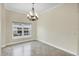Cozy room featuring a bright window and neutral paint, providing a tranquil space for relaxation and comfort at 8183 Deland St, Port Charlotte, FL 33981