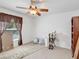 Cozy bedroom with ceiling fan and natural light, awaiting a personalized touch to transform it into a relaxing retreat at 8377 Mambo Ave, North Port, FL 34291