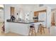 Spacious kitchen featuring granite countertops, stainless steel sink, and ample cabinet space at 8377 Mambo Ave, North Port, FL 34291