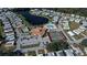 Community aerial shot featuring a pool, lake, and tennis courts offering multiple leisure activities at 857 Seabrooke Dr, Englewood, FL 34223
