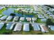 Aerial view of the community showcasing the home's location near a lake at 857 Seabrooke Dr, Englewood, FL 34223