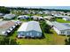 Aerial view of the residence, boasting a pristine lawn and proximity to nearby amenities at 857 Seabrooke Dr, Englewood, FL 34223