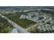 Extensive aerial showcasing the community layout with multiple ponds and various home styles at 857 Seabrooke Dr, Englewood, FL 34223
