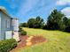 Expansive backyard with mature trees, mulch beds, and a tranquil setting for outdoor enjoyment at 857 Seabrooke Dr, Englewood, FL 34223