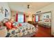 Comfortable bedroom with coral accents, features a mirrored closet and ceiling fan at 857 Seabrooke Dr, Englewood, FL 34223
