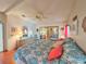 Spacious bedroom with a patterned comforter set, mirrored closet doors, and a bright and airy feel at 857 Seabrooke Dr, Englewood, FL 34223