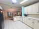 Spacious kitchen offering seamless flow to the dining area, perfect for entertaining guests at 857 Seabrooke Dr, Englewood, FL 34223