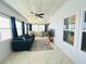 Bright living room offers comfortable seating, modern decor, and plenty of natural light at 857 Seabrooke Dr, Englewood, FL 34223