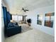 Bright living room showcases modern décor, plush seating, and expansive windows for a welcoming ambiance at 857 Seabrooke Dr, Englewood, FL 34223