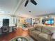 Open-concept living area with a kitchen island, dining space, and comfortable seating for seamless entertaining at 857 Seabrooke Dr, Englewood, FL 34223