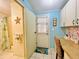 Mud Room featuring a flamingo mat, built-in desk, ample storage, and access to a full bathroom at 857 Seabrooke Dr, Englewood, FL 34223