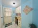 Mud Room with natural light, built-in desk and storage, and a decorative floral accent wall at 857 Seabrooke Dr, Englewood, FL 34223
