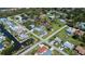 Aerial view showcasing property location within a waterfront community, lush landscaping, and neighborhood streets at 900 Stewart St, Englewood, FL 34223