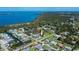 Wide aerial view of a neighborhood showcasing a waterfront community with lush surroundings and nearby ocean access at 900 Stewart St, Englewood, FL 34223