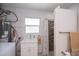 Bathroom featuring a walk-in shower, vanity and ample storage at 900 Stewart St, Englewood, FL 34223