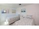 Bright bedroom with two twin beds and beach-themed decor at 900 Stewart St, Englewood, FL 34223