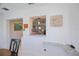 The dining area has a pass-through to the kitchen, offering a bright and open space at 900 Stewart St, Englewood, FL 34223