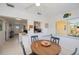 The dining area has a pass-through to the kitchen, offering a bright and open space at 900 Stewart St, Englewood, FL 34223