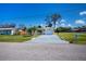 Delightful single-story home with an attached one-car garage and an expansive driveway providing ample parking at 900 Stewart St, Englewood, FL 34223