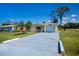 Delightful single-story home with an attached one-car garage and an expansive driveway providing ample parking at 900 Stewart St, Englewood, FL 34223