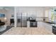Bright kitchen features granite counters, stainless appliances, and ample cabinet space at 900 Stewart St, Englewood, FL 34223