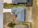 Top-down aerial view of a well-maintained home with a new roof and tidy landscaping at 97 Pine Valley Ln, Rotonda West, FL 33947