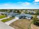 Aerial view of the home in a friendly neighborhood with lush surroundings at 97 Pine Valley Ln, Rotonda West, FL 33947