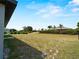 Large, open backyard ready for your personal touch and outdoor activities at 97 Pine Valley Ln, Rotonda West, FL 33947