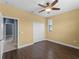 Bedroom boasts hardwood floors, closet space, and a soothing color palette at 97 Pine Valley Ln, Rotonda West, FL 33947