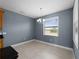 Dining area with modern chandelier, tile floors and large window at 97 Pine Valley Ln, Rotonda West, FL 33947