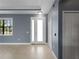 Entryway featuring neutral tile floors, blue walls, a closet and a bright white front door with sidelight at 97 Pine Valley Ln, Rotonda West, FL 33947