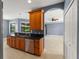 Open kitchen with wooden cabinets, granite counters, and stainless steel appliances at 97 Pine Valley Ln, Rotonda West, FL 33947