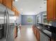 Beautiful kitchen with wooden cabinets, stainless steel appliances, and an open-concept design at 97 Pine Valley Ln, Rotonda West, FL 33947