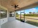 The screened lanai boasts a ceiling fan and a large outdoor living space at 97 Pine Valley Ln, Rotonda West, FL 33947