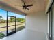 Screened lanai offers a spacious area with views of the manicured backyard at 97 Pine Valley Ln, Rotonda West, FL 33947