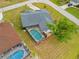 A luxurious home features a screened pool and a well-maintained yard, offering privacy and outdoor enjoyment at 1 Sportsman Way, Rotonda West, FL 33947