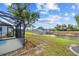 Landscaped backyard with canal view at 1 Sportsman Way, Rotonda West, FL 33947