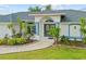 Charming single Gathering home featuring a two-car garage and a well-manicured lawn at 1 Sportsman Way, Rotonda West, FL 33947
