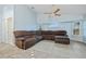 Spacious living room with vaulted ceiling, a ceiling fan, and a large sectional couch at 1 Sportsman Way, Rotonda West, FL 33947