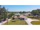 Well-maintained home features a spacious front yard, mature landscaping, and a convenient driveway leading to an attached garage at 10112 Willmington Blvd, Englewood, FL 34224