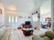 Spacious living room featuring tile floors, white walls, and natural light with a glimpse of the dining room at 10112 Willmington Blvd, Englewood, FL 34224