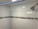 Modern shower with mosaic tile accent and silver shower head at 10112 Willmington Blvd, Englewood, FL 34224