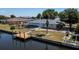 Waterfront property with a private dock and fenced backyard, perfect for outdoor living and relaxation at 110 Colonial Sw St, Port Charlotte, FL 33952