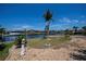 Well-manicured backyard with canal access and boat dock at 110 Colonial Sw St, Port Charlotte, FL 33952