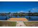 Waterfront property featuring a private wooden dock with access to a canal and serene water views, perfect for boating at 110 Colonial Sw St, Port Charlotte, FL 33952