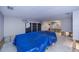Renovated living room with blue tarp covering furniture, showcasing recent updates at 110 Colonial Sw St, Port Charlotte, FL 33952