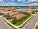 Desirable aerial view in a community with lush lawns and lake with fountain at 11819 Sistine Ln, Venice, FL 34293