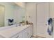 Bright bathroom with white cabinets, quarts countertop, and decor at 11819 Sistine Ln, Venice, FL 34293