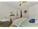 Bedroom with ceiling fan, a comfortable armchair, and decor at 11819 Sistine Ln, Venice, FL 34293